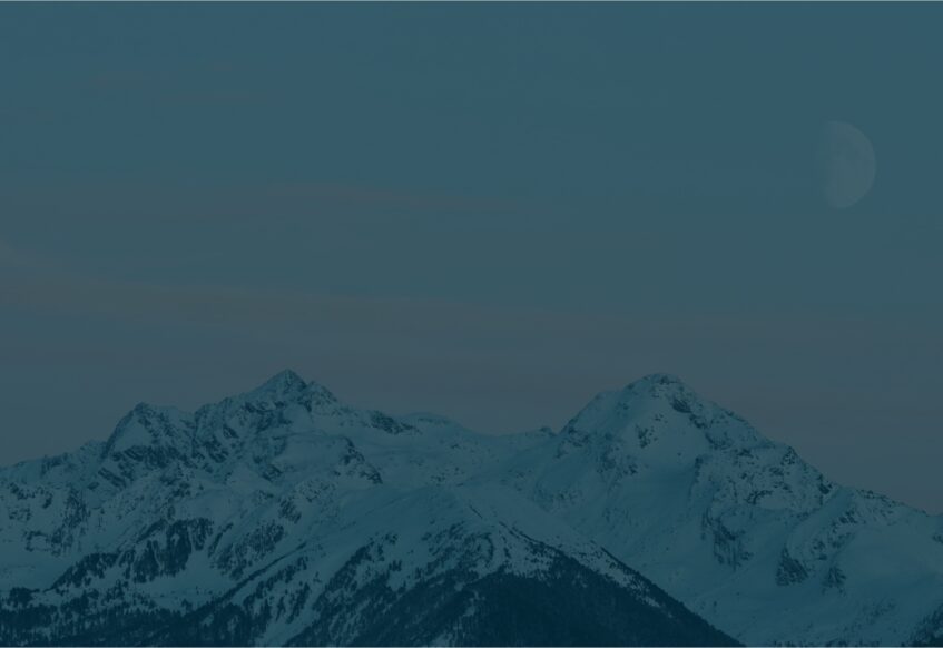 Mountains against a dark blue overlay