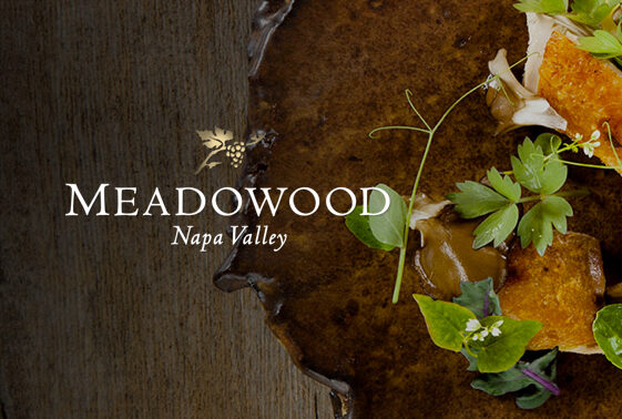 http://Meadowood%20Napa%20Valley%20over%20a%20wooden%20table%20with%20leaves