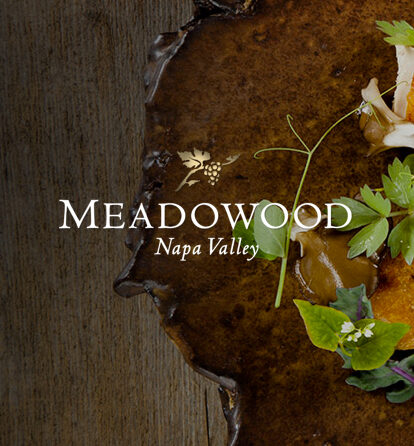 http://Meadowood%20Napa%20Valley%20over%20a%20wooden%20table%20with%20leaves